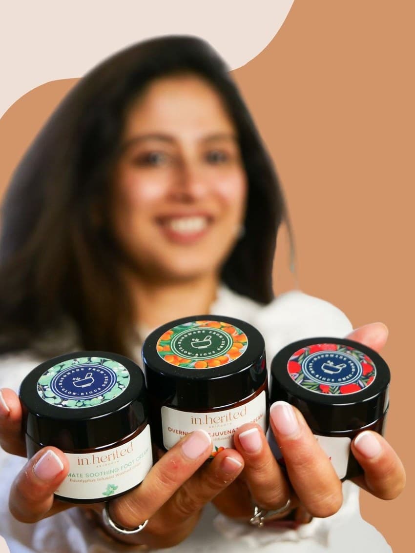 Founder Suruchi holding the Inherited Skincare collection