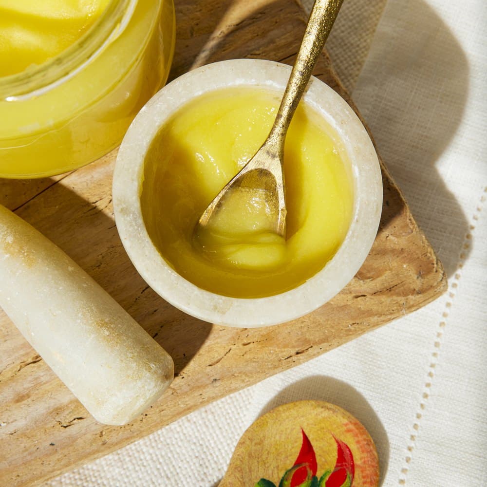 Warm ghee in a marble bowl